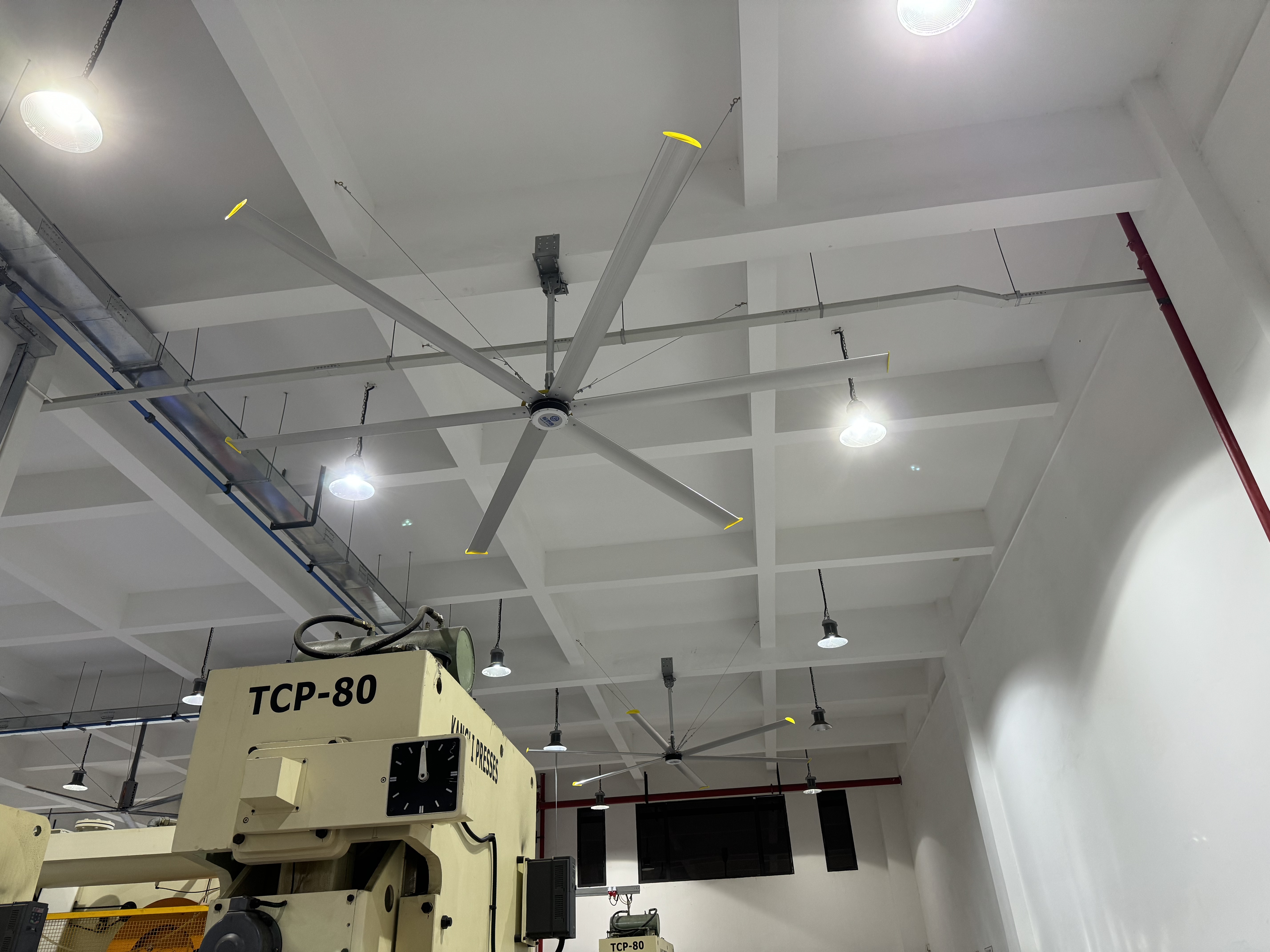 Industrial big fan installed in a high ceiling workshop